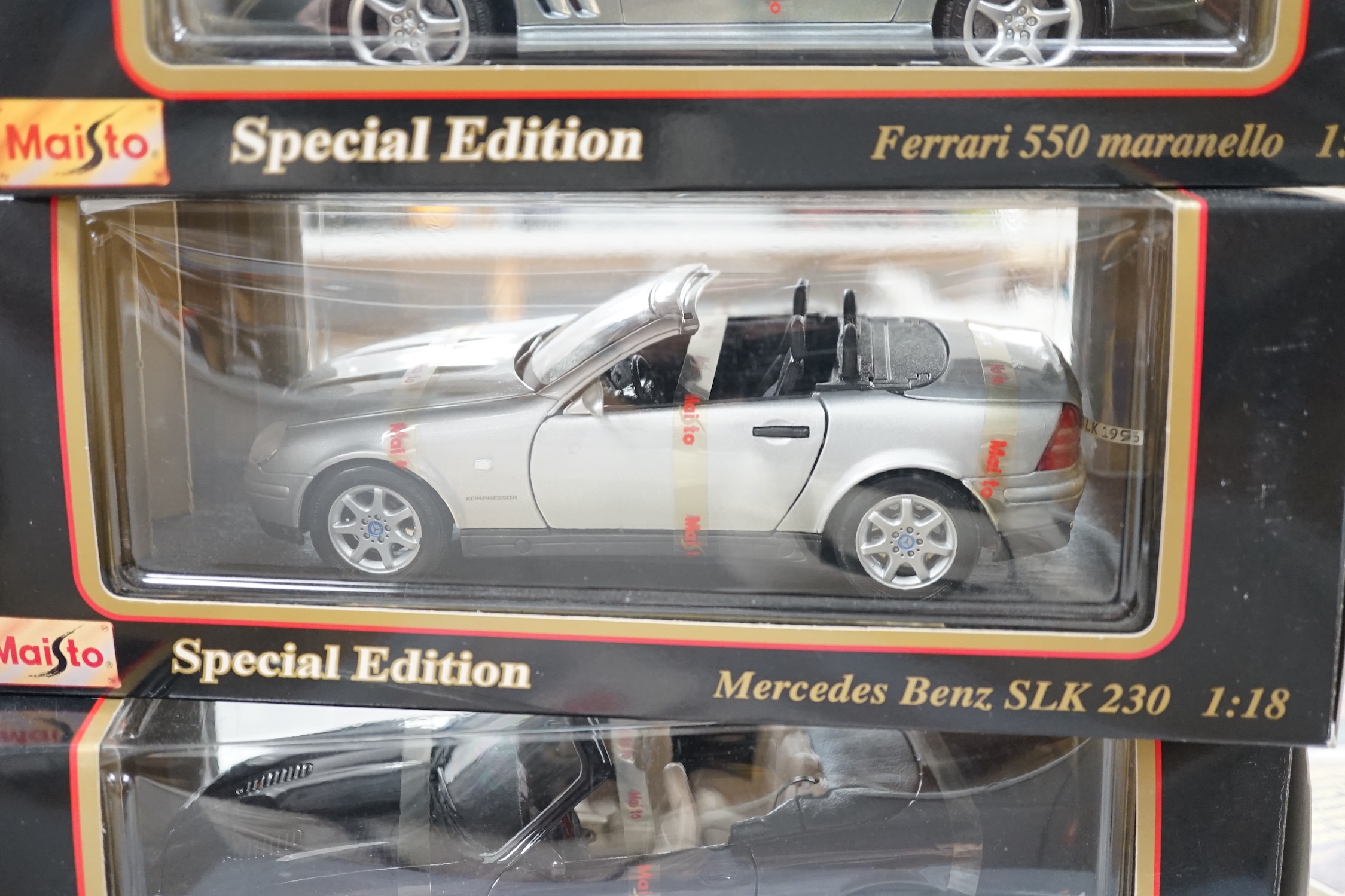 Five boxed 1:18 model cars by Maisto and Bburago; Jaguar S-Type, Jaguar XKR, Ferrari 550 maranello, Mercedes-Benz SLK 230 and a BWM M roadster
